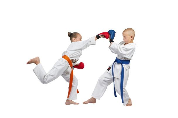 Children in karategi are training karate blows - Photo, Image