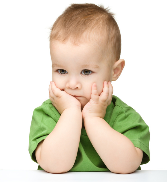Pensive little boy support his head with hands - Photo, Image