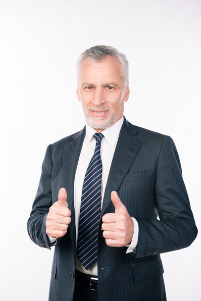 old confident  businessman showing thumbs up and smiling - Fotografie, Obrázek