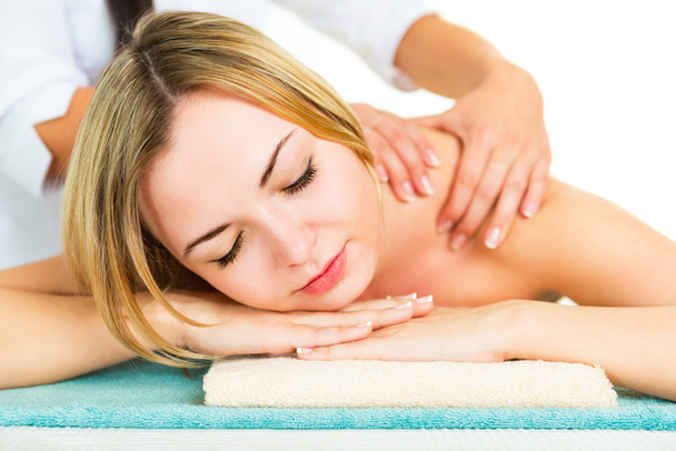 Beautiful young woman during the massage. - Zdjęcie, obraz