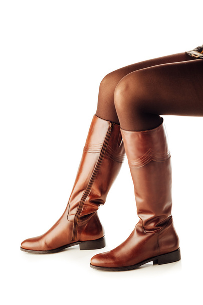 茶色身に着けている女性の足革ロングブーツ - 写真・画像