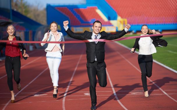 business people running on racing track - Foto, Bild