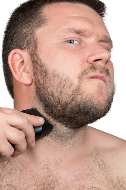 Man shaving with electric razor - Photo, image