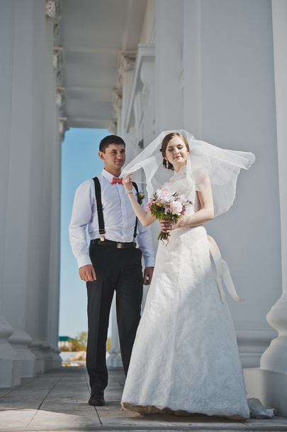 Newlyweds hugging on the background of the Church 3901. - Photo, Image