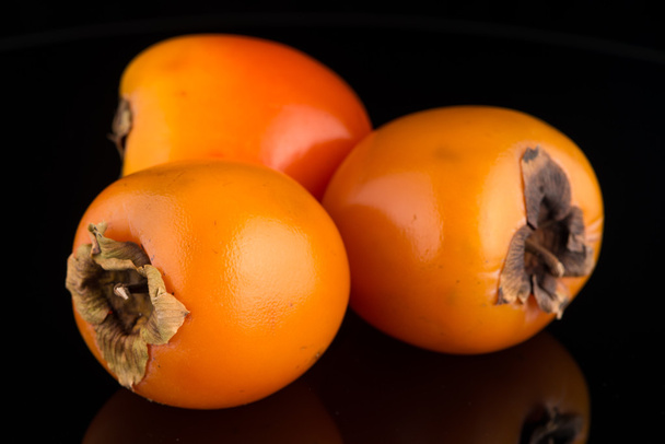 Closeup of persimmon fruits - Foto, imagen