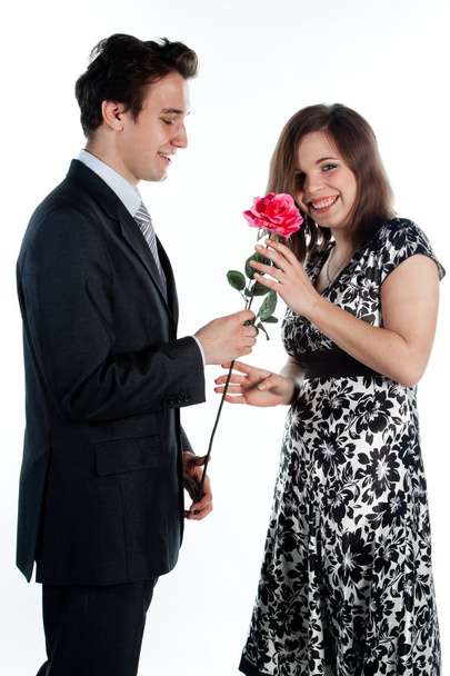 Man gives a woman flowers - Foto, afbeelding