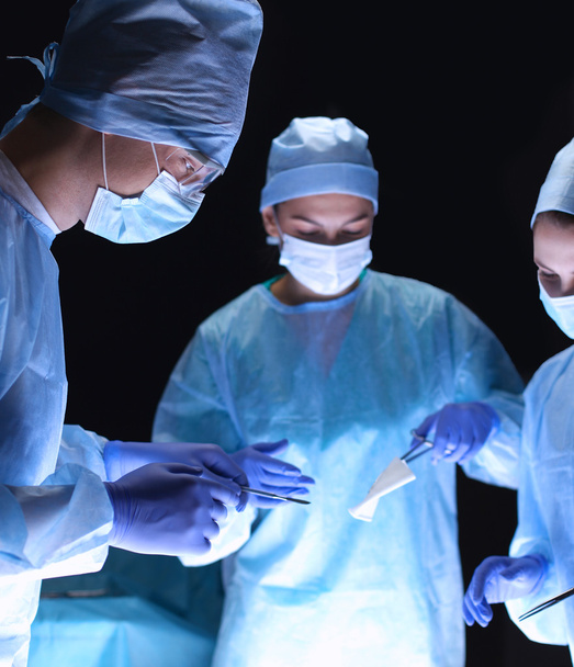 Team surgeon at work in operating room. - Foto, immagini