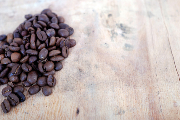roasted coffee on a wooden background - Photo, Image