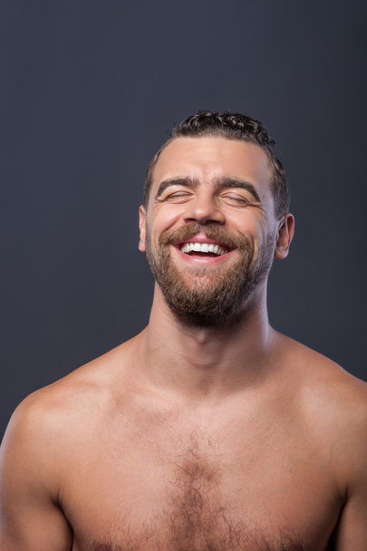Cheerful bare guy with beard is happy - Φωτογραφία, εικόνα