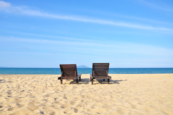 Beach chairs on sand beach. Concept for rest, relaxation, holiday - Photo, Image