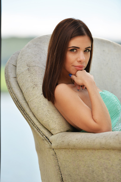 Girl in sofa outdoors - Photo, Image