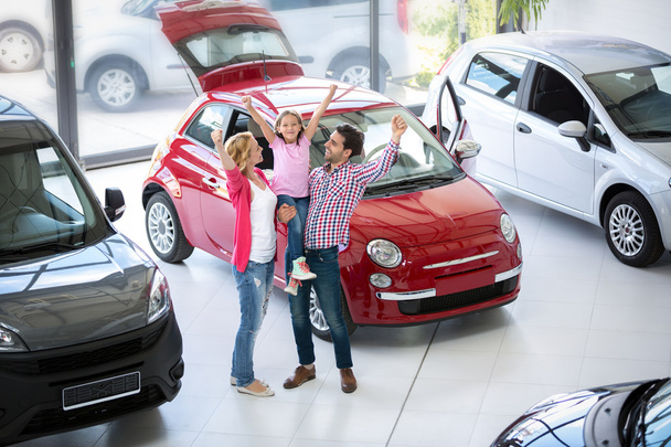 excited family buying a new car - 写真・画像