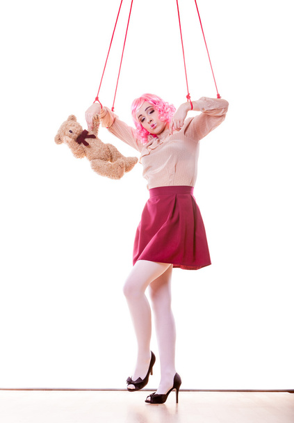 woman girl stylized like marionette puppet on string - Foto, Bild