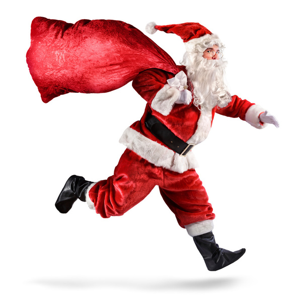 Santa Claus corriendo con una bolsa de regalos sobre un fondo blanco
 - Foto, Imagen