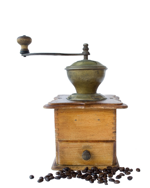 Старовинна кавомолка і зерно кави
 - Фото, зображення