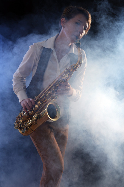 Attractive woman plays saxophone - Fotoğraf, Görsel