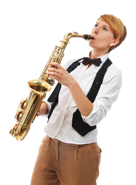 woman professionally plays jazz on saxophone - Foto, afbeelding