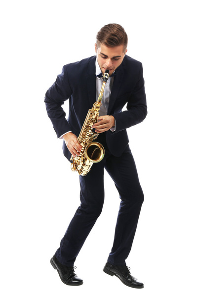 Elegant happy saxophonist plays music on sax on white background - Photo, Image