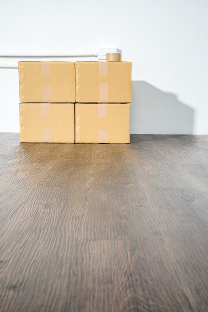Pile of cardboard boxes on white background with box shadow - Foto, immagini