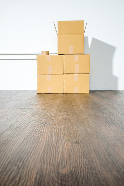 Pile of cardboard boxes on white background with box shadow - Fotografie, Obrázek