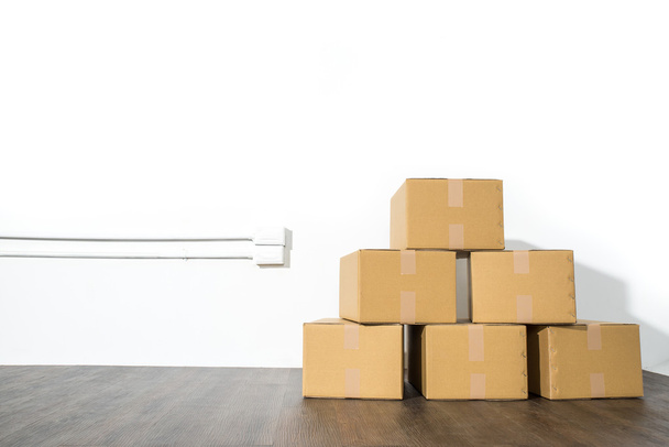 Pile of cardboard boxes on white background with box shadow - Φωτογραφία, εικόνα
