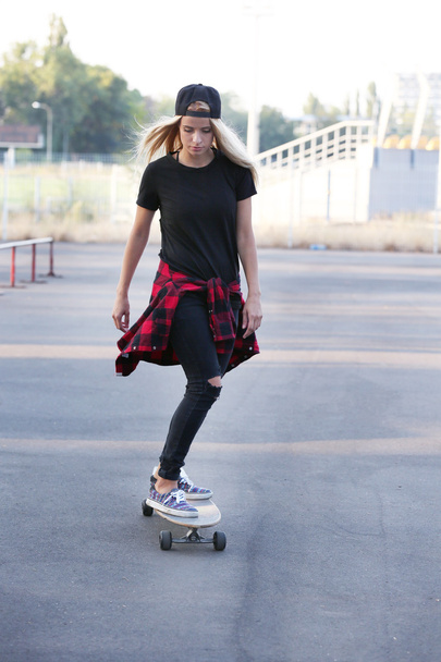 woman with skating board  - Фото, зображення