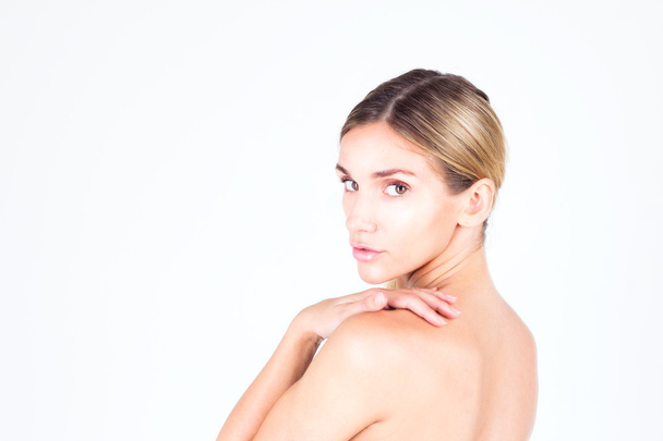 Young woman with beautiful skin and a naked back. Beauty concept. - Photo, Image