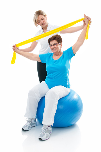 Senior woman in gym - Фото, изображение