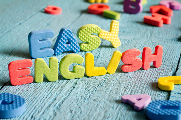English is easy to learning concept with letters on blue boards - Foto, Imagem
