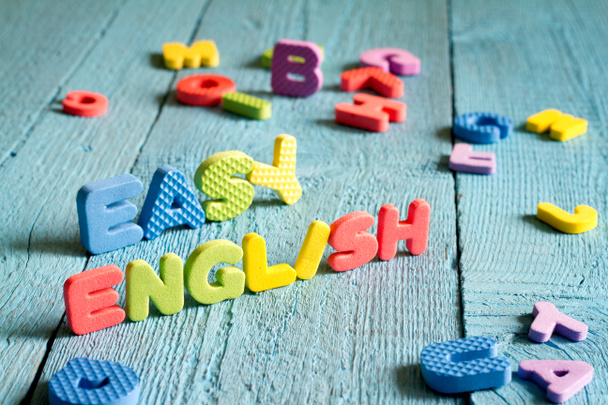 English is easy to learning concept with letters on blue boards - Foto, Imagen