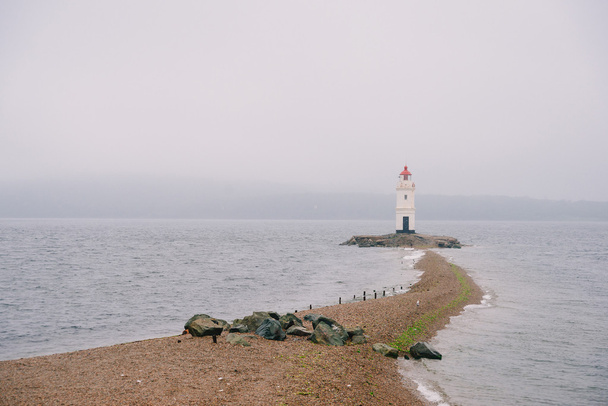 Tokarevskiy lighthouse on coast - Foto, Imagen
