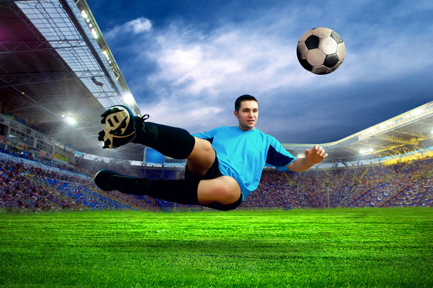 Football player on field of stadium - Foto, Bild