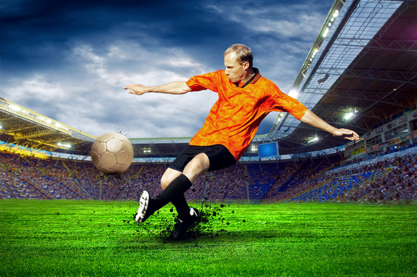 Football player on field of stadium - Fotoğraf, Görsel