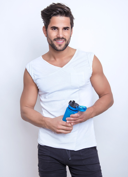 young and fit man with earphones - Foto, imagen