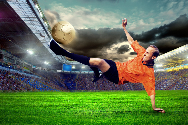 Football player on field of stadium - Фото, изображение