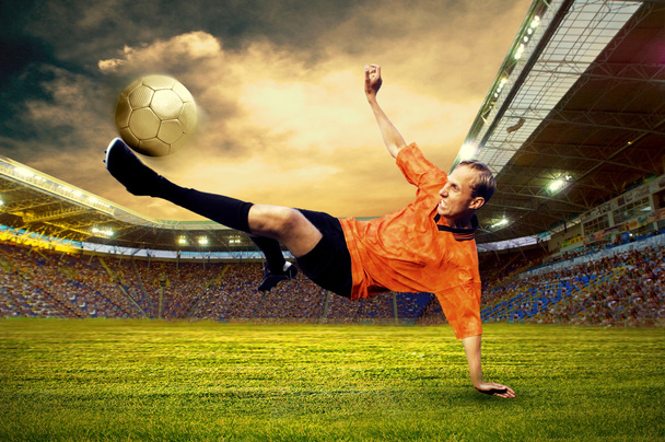 Football player on field of stadium - Foto, immagini