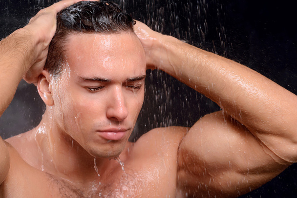 Handsome guy taking shower - Fotoğraf, Görsel