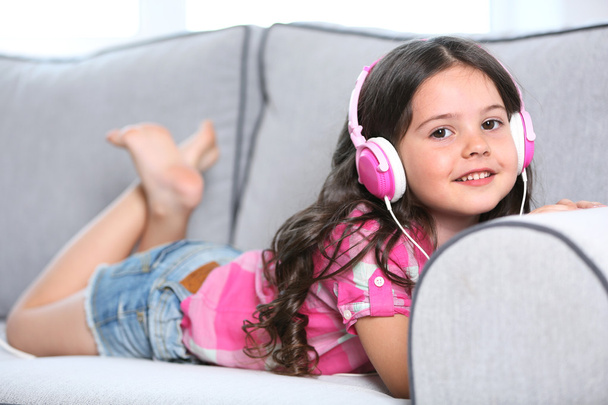 little girl listening music with headphones - Photo, Image
