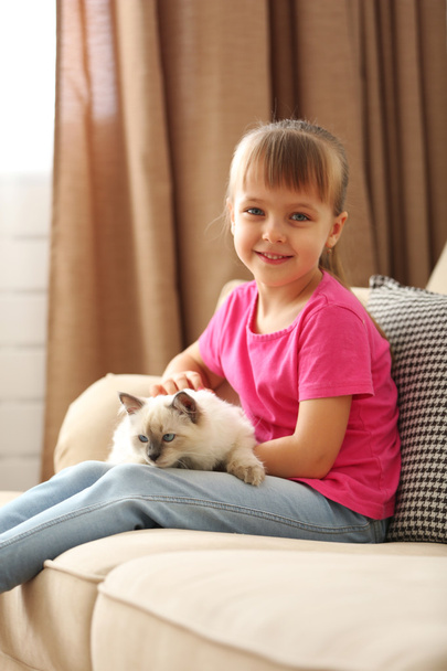 Little cute girl with kitten - Valokuva, kuva