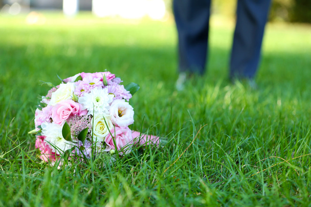 Wedding bouquet on grass of couple background - Photo, Image