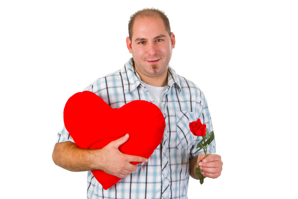 Young man holding red heart - Zdjęcie, obraz