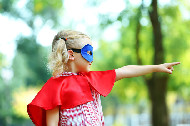 Superhero little girl at the park - Foto, Bild