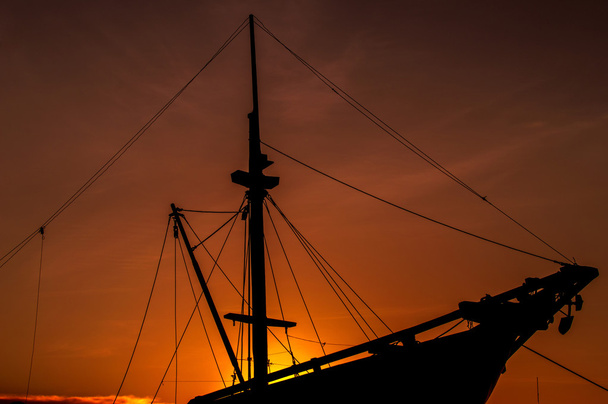 silhouette wooden ship at sunset - Photo, Image