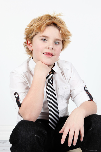 Cute little boy posing for camera on white background - Foto, Bild