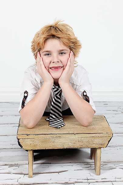 Cute little boy posing for camera on white background - Fotó, kép