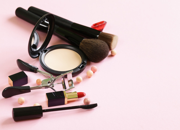 cosmetics set for make-up (face powder, lipstick, mascara brush) - Photo, image