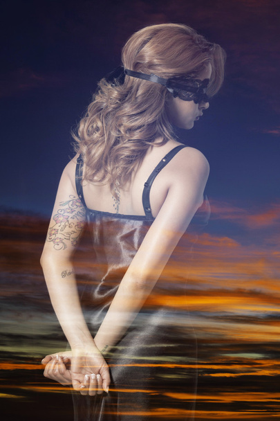 Double exposure of blindfold woman back portrait and colorful su - Photo, Image