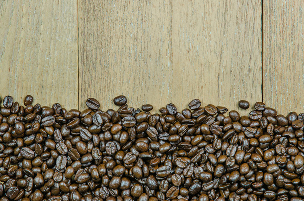 roasted coffee beans on wood background - Photo, Image