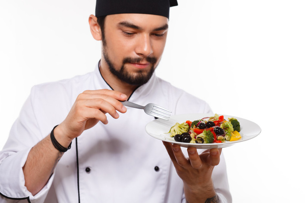 cook man happy with salad - Foto, Imagen