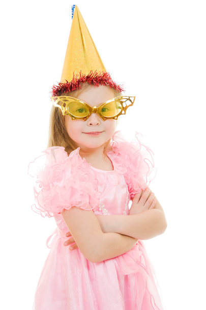 A girl in a pink dress with glasses and hat on white background. - Фото, изображение